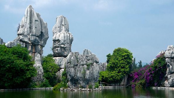 Shilin (The Stone Forest) is an otherworldly fantasy of twisted limestone formations that comprise the worlds largest natural stone maze. Geologists say the structures originated 200 million years ago with the interaction of limestone, sea water, rainwater and seismic upheavals. The bizarre pinnacles that resulted are of the distinctive type of limestone called karst, the same geology that one finds in Guilin. (Photo by: David Henley/Pictures From History/Universal Images Group via Getty Images)