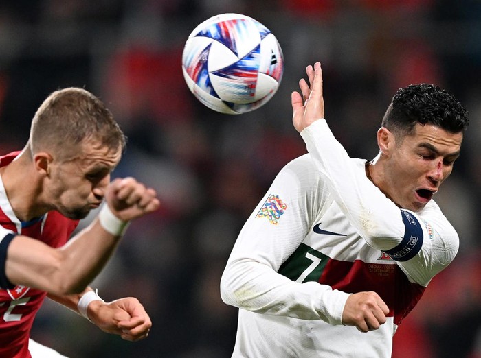 PRAGUE, CZECH REPUBLIC - SEPTEMBER 24: Cristiano Ronaldo of Portugal contends for the aerial ball, which later results in a penalty decision for handball, during the UEFA Nations League League A Group 2 match between Czech Republic and Portugal at Fortuna Arena on September 24, 2022 in Prague, Czech Republic. (Photo by Thomas Eisenhuth/Getty Images)