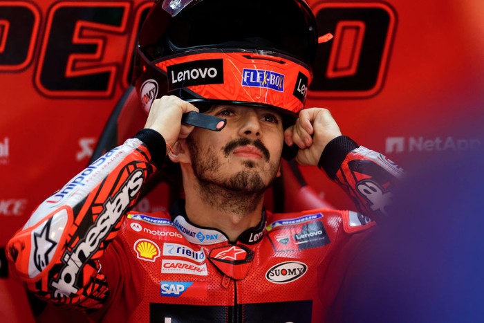 ALCANIZ, SPAIN - SEPTEMBER 18: Francesco Pecco Bagnaia of Italy and Ducati Lenovo Team putts his helmet on in his box during the MotoGP race at Motorland Aragon Circuit on September 18, 2022 in Alcaniz, Spain. (Photo by Joan Cros Garcia - Corbis/Corbis via Getty Images)