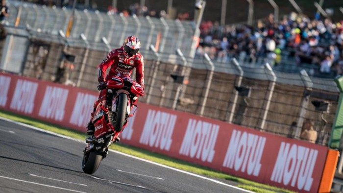 Jack Miller MOTEGI, JAPAN - SEPTEMBER 25: Jack Miller of Australia and Ducati Lenovo Team crosses the line with a wheelie during the race of the MotoGP Motul Grand Prix of Japan at Twin Ring Motegi on September 25, 2022 in Motegi, Japan. (Photo by Steve Wobser/Getty Images)