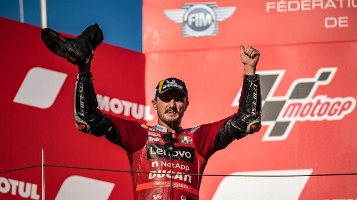 MOTEGI, JAPAN - SEPTEMBER 25: Jack Miller of Australia and Ducati Lenovo Team with his boots on the podium after he drinks Prosecco during the race of the MotoGP Motul Grand Prix of Japan at Twin Ring Motegi on September 25, 2022 in Motegi, Japan. (Photo by Steve Wobser/Getty Images)