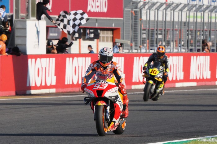 Repsol Honda Team rider Marc Marquez of Spain (L) crosses the finish line with Mooney VR46 Racing Team rider Luca Marini of Italy (R) during the MotoGP class race of the Japanese Grand Prix in Motegi, Tochigi prefecture on September 25, 2022. (Photo by Toshifumi KITAMURA / AFP) (Photo by TOSHIFUMI KITAMURA/AFP via Getty Images)