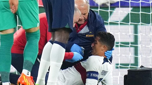 Portugals Cristiano Ronaldo is treated on the pitch during the UEFA Nations League soccer match between the Czech Republic and Portugal at the Sinobo stadium in Prague, Czech Republic, Saturday, Sept. 24, 2022. (AP Photo/Petr David Josek)