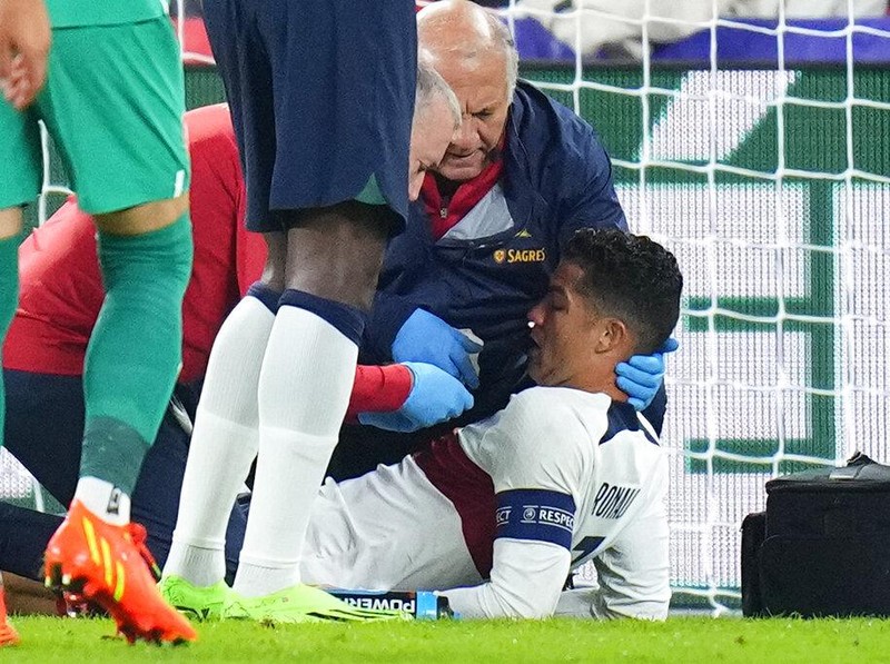 Portugal's Cristiano Ronaldo is treated on the pitch during the UEFA Nations League soccer match between the Czech Republic and Portugal at the Sinobo stadium in Prague, Czech Republic, Saturday, Sept. 24, 2022. (AP Photo/Petr David Josek)