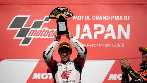MOTEGI, JAPAN - SEPTEMBER 25: Moto2 rider Ai Ogura of Japan and Idemitsu Honda Team Asia shows his trophy on the podium after his home race win during the race of the MotoGP Motul Grand Prix of Japan at Twin Ring Motegi on September 25, 2022 in Motegi, Japan. (Photo by Steve Wobser/Getty Images)