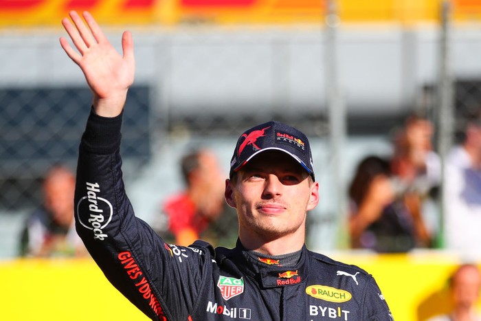MONZA, ITALY - SEPTEMBER 10: Max Verstappen of Netherlands waves the tiffosis during qualifying ahead of the F1 Grand Prix of Italy at Autodromo Nazionale Monza on September 10, 2022 in Monza, Italy. (Photo by Eric Alonso/Getty Images)