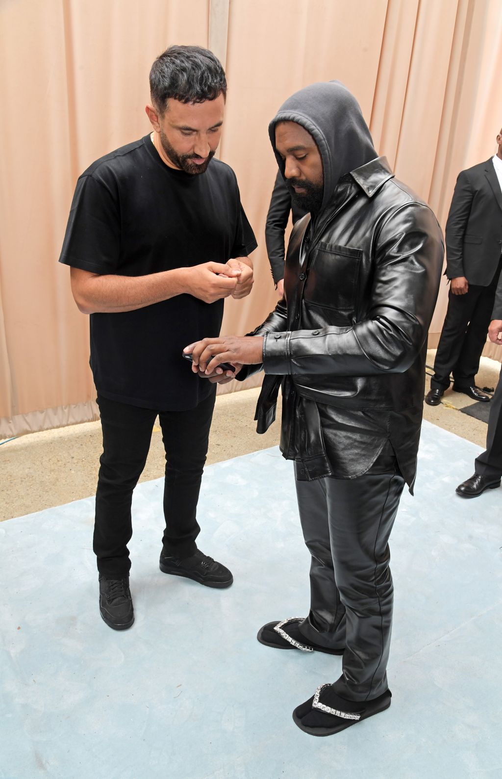 LONDON, ENGLAND - SEPTEMBER 26: CCO of Burberry Riccardo Tisci and Kanye West pose backstage at the Burberry Spring/Summer 2023 runway show in Bermondsey on September 26, 2022 in London, England. (Photo by David M. Benett/Dave Benett/Getty Images for Burberry)