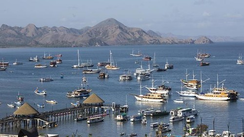 LABUAN BAJO, INDONESIA - SEPTEMBER 27: A various tourist boat are seen at Labuan Bajo marina, gateway to Komodo National Park in East Nusa Tenggara, Indonesia, on September 27, 2022. The Indonesian Central Statistics Agency (BPS) noted that the number of foreign tourist arrivals had increased after the Covid-19 pandemic in July 2022, more than 470,000 foreign tourist arrivals were reported, the highest number since the easing of restrictions on the COVID-19 pandemic. This has a domino effect in the national economy. The Indonesian government hopes that the improvement in the tourism sector will be able to contribute to the post-pandemic economic recovery. (Photo by Agoes Rudianto/Anadolu Agency via Getty Images)
