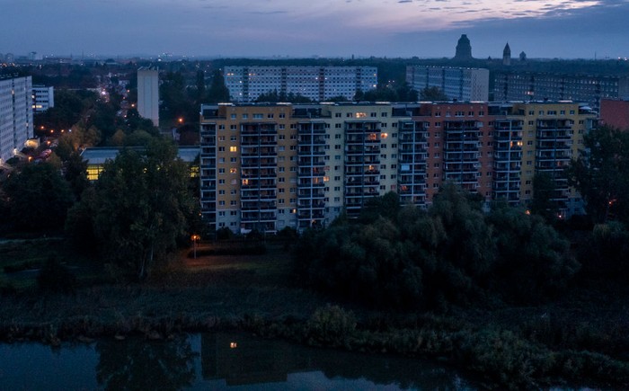 1243512688 26 September 2022, Saxony, Leipzig: The building of the gas and steam turbine plant (CCGT) of Stadtwerke Leipzig is no longer illuminated due to the energy crisis. The power plant supplies the city of Leipzig with electricity and district heating from natural gas. Photo: Jan Woitas/dpa (Photo by Jan Woitas/picture alliance via Getty Images)