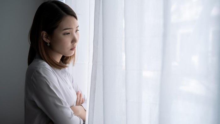 1331969258 Asian woman with stress, She kept herself alone in her bedroom, Depression.
