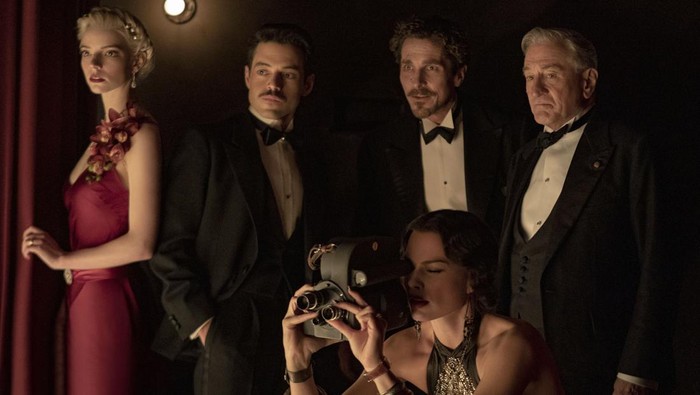 (L-R): Anya Taylor-Joy as Libby, Rami Malek as Tom, Christian Bale as Burt, Robert De Niro as Gil, and Margot Robbie as Valerie in 20th Century Studios AMSTERDAM. Photo by Merie Weismiller Wallace; SMPSP. © 2022 20th Century Studios. All Rights Reserved.