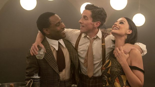 (L-R): John David Washington as Harold, Christian Bale as Burt, and JMargot Robbie as Valerie in 20th Century Studios' AMSTERDAM. Photo by Merie Weismiller. © 2022 20th Century Studios. All Rights Reserved.