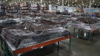 Barang-barang di dalam toko pun diselimuti plastik agar tidak rusak. (Lokman Vural Elibol/Getty Images)  