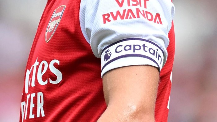 The Visit Rwanda logo is seen on the sleeve of Arsenals Norwegian midfielder Martin Odegaard during a club friendly football match between Arsenal and Sevilla at the Emirates Stadium in London on July 30, 2022. (Photo by JUSTIN TALLIS / AFP) (Photo by JUSTIN TALLIS/AFP via Getty Images)