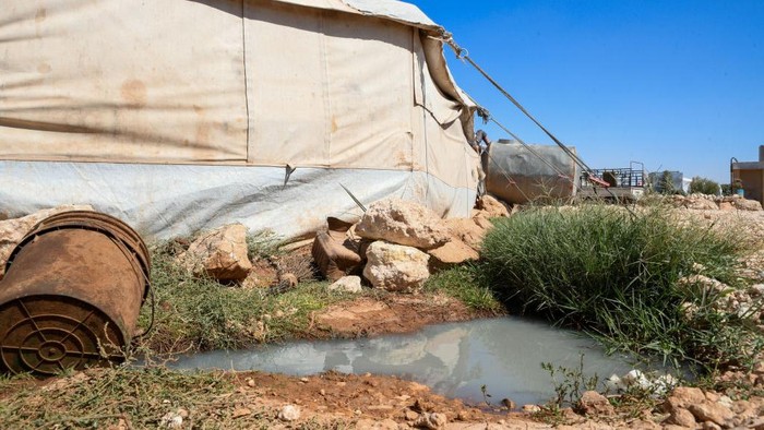 Several cases of cholera were recorded in northwestern Syria, where pictures show pools of contaminated water in front of tents for the displaced in the town of Kafr Losin in Idlib governorate, northeastern Syria, on September 28, 2022. Cholera is generally contracted from contaminated food or water and spreads in residential areas that lack proper sewerage networks or mains drinking water. (Photo by Rami Alsayed/NurPhoto via Getty Images)