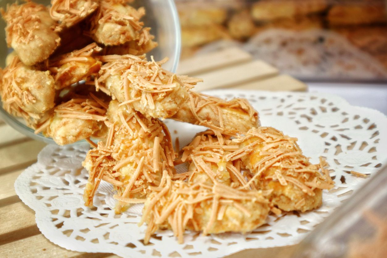 Kastengel cookies on white paper. Indonesian traditional cookies for eid al-fitr.