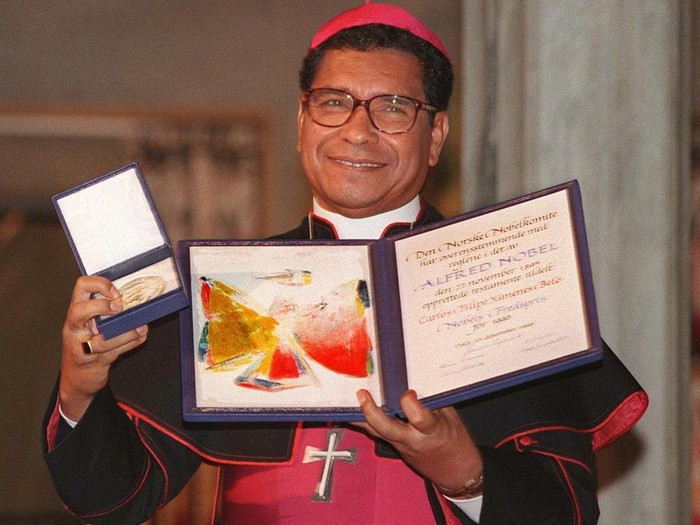 FILE - Nobel Peace Prize laureate, East Timor bishop Carlos Filipe Ximenes Belo displays his certificate and medal during the Nobel ceremony at the Oslo townhall, on Dec. 10, 1996. Belo has been accused in a Dutch magazine article of sexually abusing boys in East Timor in the 1990s, rocking the Catholic Church in the impoverished nation and forcing officials at the Vatican and his religious order to scramble to provide answers. (AP Photo/Bjoern Sigurdsoen, File)