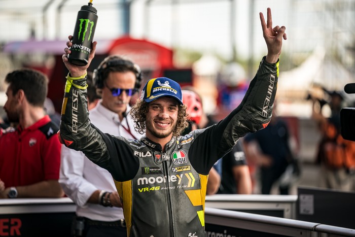 BURIRAM, THAILAND - OCTOBER 01: Marco Bezzecchi of Italy and Mooney VR46 Racing Team celebrates his pole position at parc ferme during the qualifying session of the MotoGP OR Thailand Grand Prix at Chang International Circuit on October 01, 2022 in Buriram, Thailand. (Photo by Steve Wobser/Getty Images)