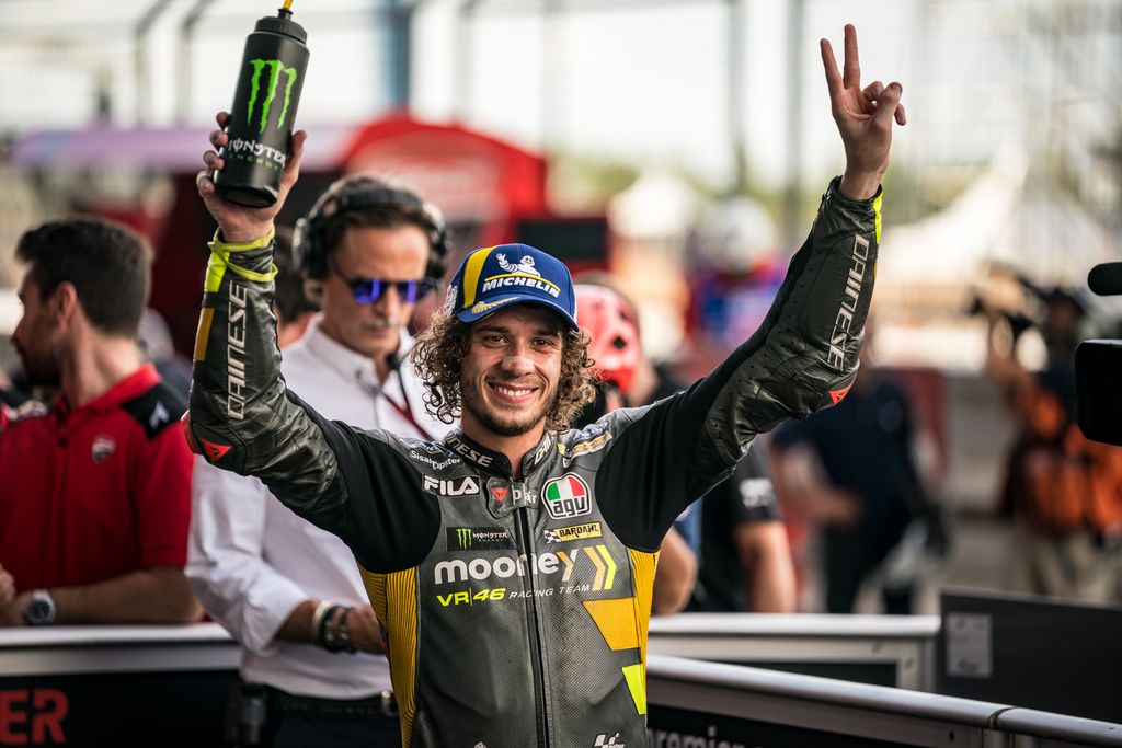 BURIRAM, THAILAND - OCTOBER 01: Marco Bezzecchi of Italy and Mooney VR46 Racing Team celebrates his pole position at parc ferme during the qualifying session of the MotoGP OR Thailand Grand Prix at Chang International Circuit on October 01, 2022 in Buriram, Thailand. (Photo by Steve Wobser/Getty Images)