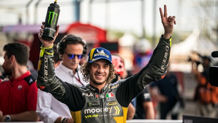 BURIRAM, THAILAND - OCTOBER 01: Marco Bezzecchi of Italy and Mooney VR46 Racing Team celebrates his pole position at parc ferme during the qualifying session of the MotoGP OR Thailand Grand Prix at Chang International Circuit on October 01, 2022 in Buriram, Thailand. (Photo by Steve Wobser/Getty Images)