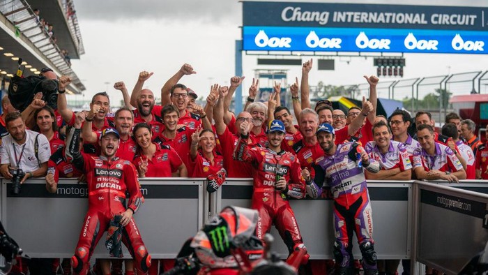BURIRAM, THAILAND - OCTOBER 02: Jack Miller of Australia and Ducati Lenovo Team, Francesco Bagnaia of Italy and Ducati Lenovo Team and Johann Zarco of France and Pramac Racing at parc ferme during the race of the MotoGP OR Thailand Grand Prix at Chang International Circuit on October 02, 2022 in Buriram, Thailand. (Photo by Steve Wobser/Getty Images)