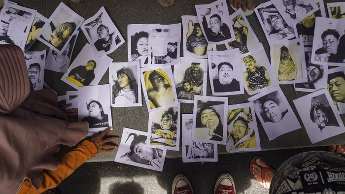 Women weep after receiving confirmation that their family member is among those killed in a soccer riots, at a hospital in Malang, East Java, Indonesia, Sunday, Oct. 2, 2022. Panic at an Indonesian soccer match Saturday left over 150 people dead, most of whom were trampled to death after police fired tear gas to dispel the riots. (AP Photo/Dicky Bisinglasi)
