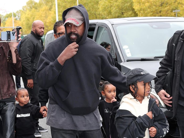VILLEPINTE, FRANCE - OCTOBER 02: Kanye West, Saint West, Psalm West and Chicago West attend the Balenciaga Womenswear Spring/Summer 2023 show as part of Paris Fashion Week on October 02, 2022 in Villepinte, France. (Photo by Jacopo M. Raule/Getty Images For Balenciaga )