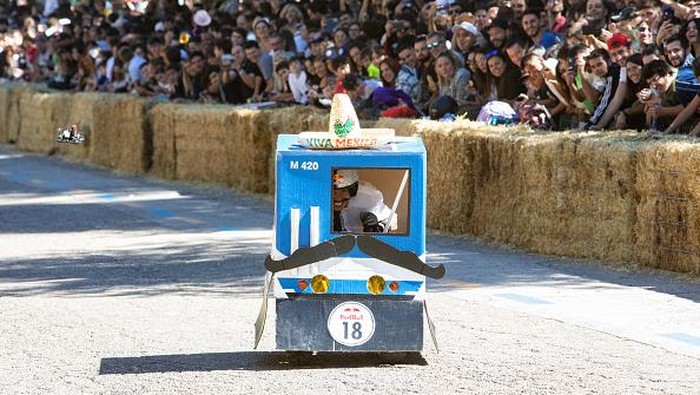 MADRID, SPAIN - OCTOBER 02:  Participants drive their soapboxes down a street during the Red Bull Autos Locos soapbox race on October 02, 2022 in Madrid, Spain. Red Bull Soapbox Race is an international event in which amateur drivers race homemade soapbox vehicles.  (Photo by Aldara Zarraoa/Getty Images)