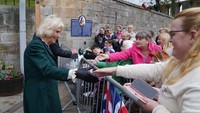 Camilla tampil mengenakan dress berwarna hijau dalam kesempatan itu. (Foto: Andrew Milligan/Getty Images) 