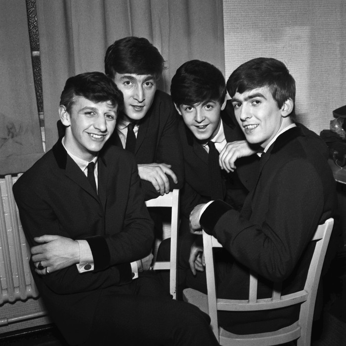 The Beatles pose for an eraly group portrait, backstage, (L-R) Ringo Starr, John Lennon, Paul McCartney, George Harrison, 1962. (Photo by Harry Hammond/V&A Images/Getty Images)