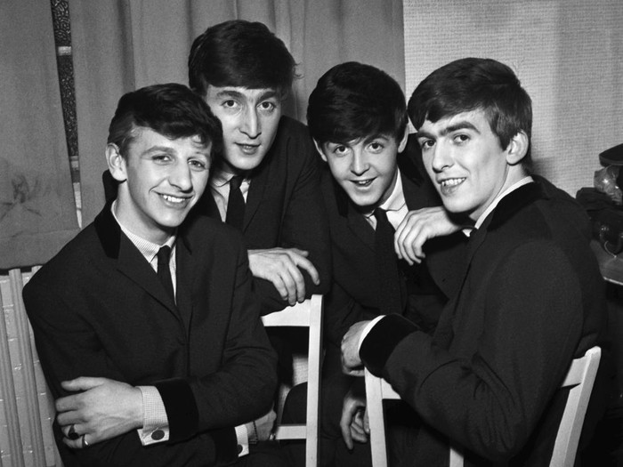 The Beatles pose for an eraly group portrait, backstage, (L-R) Ringo Starr, John Lennon, Paul McCartney, George Harrison, 1962. (Photo by Harry Hammond/V&A Images/Getty Images)
