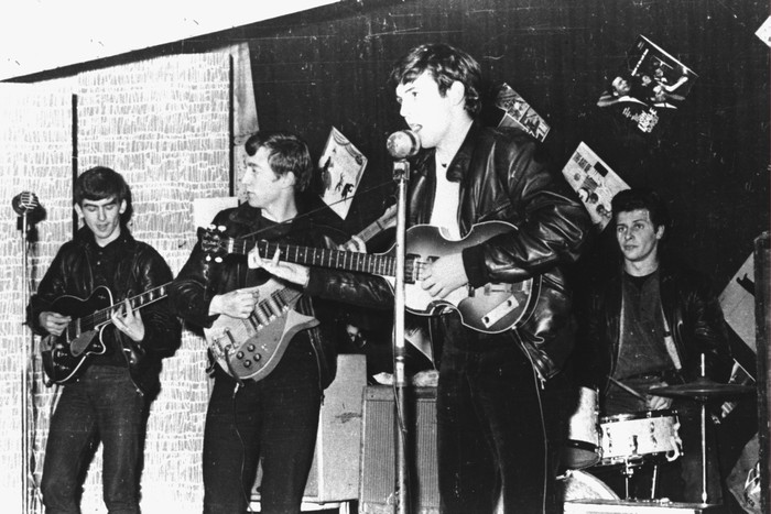 British rock group The Beatles perform in a club  prior to signing their first recording contract, Liverpool, England, 1962. L-R: George Harrison, John Lennon, Paul McCartney, and original drummer Pete Best. (Photo by Hulton Archive/Getty Images)
