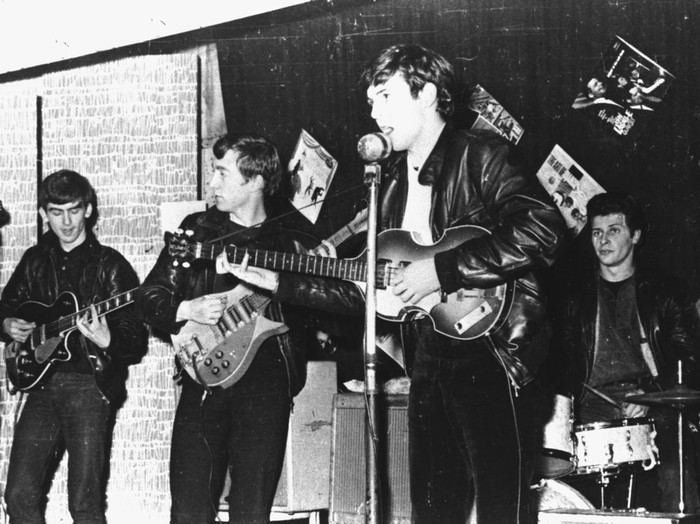 British rock group The Beatles perform in a club  prior to signing their first recording contract, Liverpool, England, 1962. L-R: George Harrison, John Lennon, Paul McCartney, and original drummer Pete Best. (Photo by Hulton Archive/Getty Images)