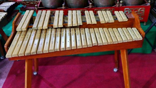 Kolintang or kulintang is a musical instrument consisting of rows of small gongs placed horizontally. This instrument is played accompanied by a larger hanging gong and drum.