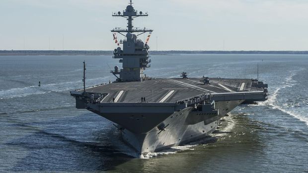 FILE - In this Saturday, April 8, 2017 file photo provided by the U.S. Navy, the USS Gerald R. Ford embarks on the first of its sea trials to test various state-of-the-art systems on its own power for the first time, from Newport News, Va. Naval Sea Systems Command spokesman William Couch said in a statement that the USS Gerald R. Ford arrived Sunday, July 15, 2018, at Newport News Shipbuilding. Work at the shipyard will mark the next phase in the development of the Navy's most advanced and scrutinized warship.  (Mass Communication Specialist 2nd Class Ridge Leoni/U.S. Navy via AP, File)