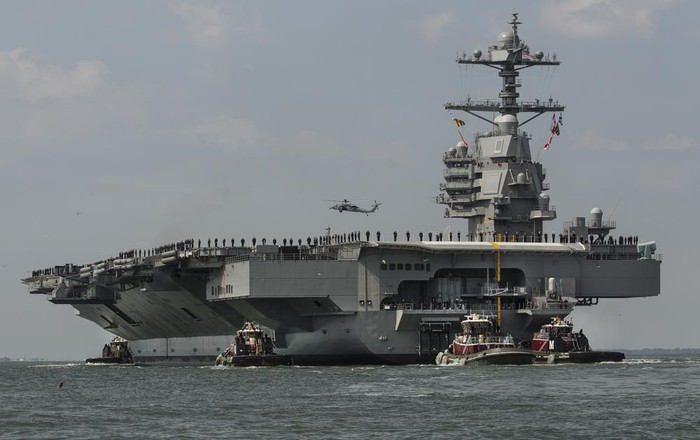 FILE - The aircraft carrier USS Gerald R. Ford heads to the Norfolk, Va., naval station on April 14, 2017. The USS Gerald R. Ford leaves the worlds largest Navy base in Norfolk on Monday, Oct. 3, 2022, along with destroyers and other warships, the U.S. Navy said in a statement Thursday, Sept. 29, 2022. The carrier strike group will join ships in the Atlantic Ocean from countries that include France, Germany and Sweden for various exercises, such as anti-submarine warfare. (Bill Tiernan/The Virginian-Pilot via AP, File)