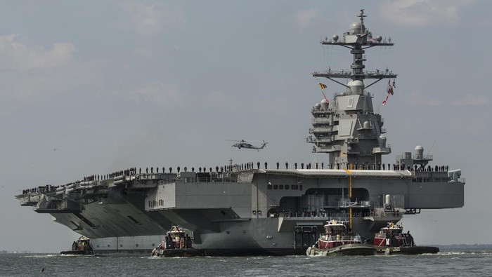 FILE - The aircraft carrier USS Gerald R. Ford heads to the Norfolk, Va., naval station on April 14, 2017. The USS Gerald R. Ford leaves the worlds largest Navy base in Norfolk on Monday, Oct. 3, 2022, along with destroyers and other warships, the U.S. Navy said in a statement Thursday, Sept. 29, 2022. The carrier strike group will join ships in the Atlantic Ocean from countries that include France, Germany and Sweden for various exercises, such as anti-submarine warfare. (Bill Tiernan/The Virginian-Pilot via AP, File)