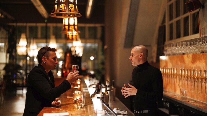 A group of diners have a drink and candle lit dinner at Brasserie Surrealiste in Brussels, Wednesday, Sept. 28, 2022. A group of restaurant owners in Brussels has imagined how a future without gas and electricity would look like for gourmets. Dinner guests, served at the Brasserie Surrealiste and cooked by Racines restaurant employees, were the first to experience it: No ovens, no stoves, no hot plates, no coffee machines and no light bulbs. (AP Photo/Olivier Matthys)