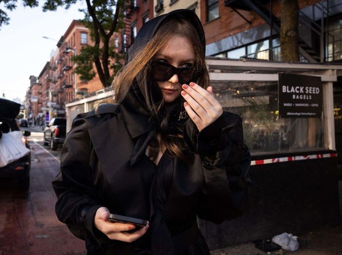 With attorney Todd Spodek (L) and Judge Diane Kiesel (R) in the background, fake German heiress Anna Sorokin is led away after being sentenced in Manhattan Supreme Court May 9, 2019 following her conviction last month on multiple counts of grand larceny and theft of services. (Photo by TIMOTHY A. CLARY / AFP)        (Photo credit should read TIMOTHY A. CLARY/AFP via Getty Images)