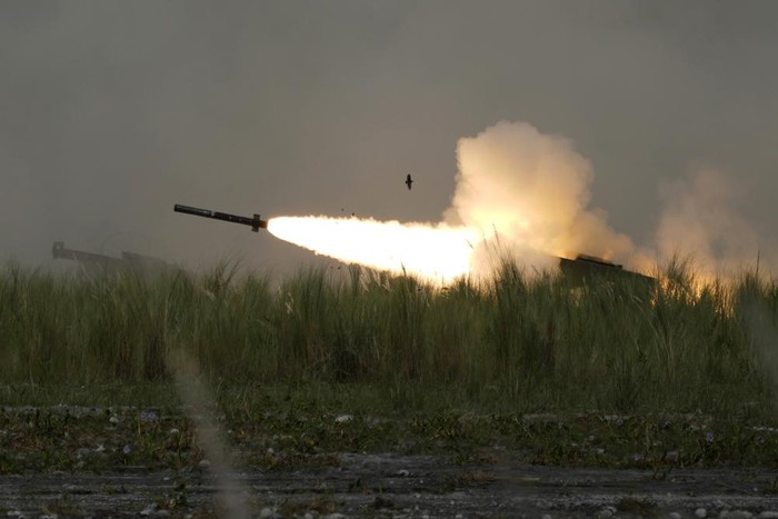 A U.S. M142 High Mobility Artillery Rocket System (HIMARS) fires a missile during annual combat drills between the Philippine Marine Corps and U.S. Marine Corps in Capas, Tarlac province, northern Philippines, Thursday, Oct. 13, 2022. Truck-mounted launchers blasted off rockets Thursday and U.S. stealth fighter jets streaked across the northern Philippine sky in a combat drill and latest display of American firepower in a region where Washington has tried to deter what it warns as Chinas growing aggression. (AP Photo/Aaron Favila)