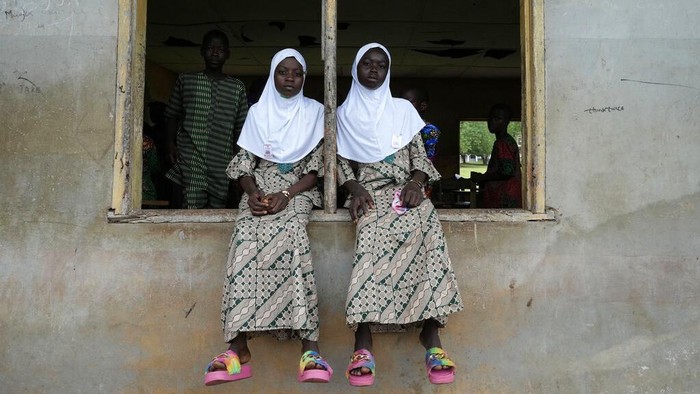 Twins attend the annual twins festival in Igbo-Ora South west Nigeria, Saturday, Oct. 8, 2022. The town holds the annual festival to celebrate the high number of twins and multiple births. (AP Photo/Sunday Alamba)