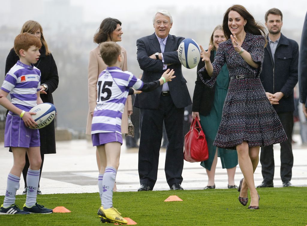 PARIS, FRANCE - MARCH 18:  Britain's Catherine, Duchess of Cambridge and Prince William, Duke of Cambridge (not in picture) meet young French rugby fans at the Trocadero square near the Eiffel Tower on March 18, 2017 in Paris, France. The Duke and Duchess of Cambridge are on an official two-day visit to Paris.  (Photo by Chesnot/Getty Images)