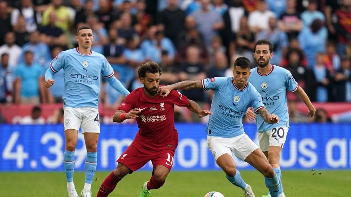 Liverpools Mohamed Salah and Manchester Citys Joao Cancelo battle for the ball during the FA Community Shield match at the King Power Stadium, Leicester. Picture date: Saturday July 30, 2022. (Photo by Nick Potts/PA Images via Getty Images)