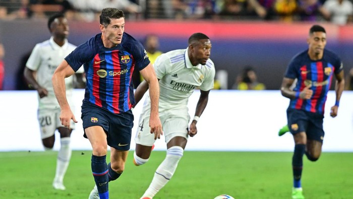 Barcelonas Robert Lewandowski runs with the ball during the international friendly football match between Barcelona and Real Madrid at Allegiant Stadium in Las Vegas, Nevada, on July 23, 2022. (Photo by Frederic J. BROWN / AFP) (Photo by FREDERIC J. BROWN/AFP via Getty Images)