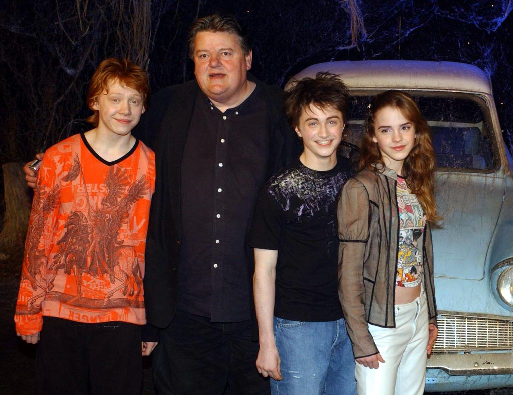 The stars of Harry Potter and the Chamber of Secrets, from left to right; Rupert Grint, Robbie Coltrane, Daniel Radcliffe Emma Watson during the worldwide launch of the DVD/VHS at Leavesden Studios in north London.   (Photo by Yui Mok - PA Images/PA Images via Getty Images)