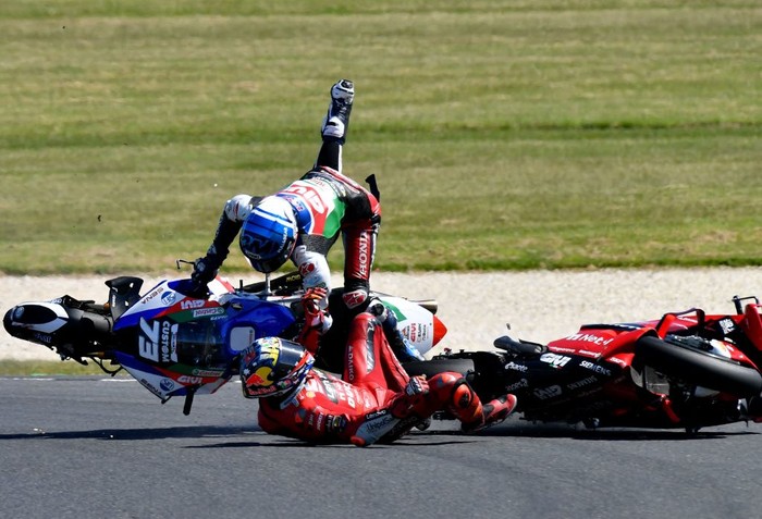 Ducati Lenovos Australian rider Jack Miller (R) crashes with LCR Honda Castrols Spanish rider Alex Marquez during the MotoGP Australian Grand Prix at Phillip Island on October 16, 2022. - -- IMAGE RESTRICTED TO EDITORIAL USE - STRICTLY NO COMMERCIAL USE -- (Photo by John MORRIS / AFP) / -- IMAGE RESTRICTED TO EDITORIAL USE - STRICTLY NO COMMERCIAL USE -- (Photo by JOHN MORRIS/AFP via Getty Images)