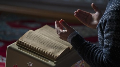 Muslims prayer namaz in mosque sunlight from window