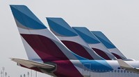 Pesawat Eurowings terparkir di Bandara Franz-Josef-Strauss, Munich. Pesawat tidak terbang karena pilotnya mogok kerja. Foto: AFP via Getty Images/CHRISTOF STACHE