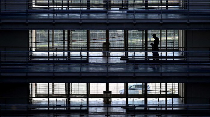 A passenger stands at a counter of the German airline Eurowings at the Franz-Josef-Strauss Airport in Munich, southern Germany, on October 17, 2022. - Pilots at the Lufthansa subsidiary Eurowings went on a three-day strike on October 17, 2022 to fight for better working conditions. (Photo by Christof STACHE / AFP) (Photo by CHRISTOF STACHE/AFP via Getty Images)