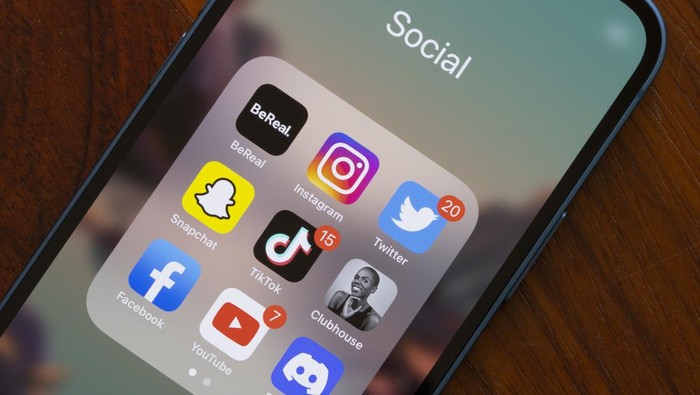 Portland, OR, USA - Aug 23, 2022: Assorted popular social media apps - BeReal, Instagram, Twitter, Snapchat, TikTok, Clubhouse, Facebook, YouTube, and Discord - are seen on an iPhone. BeReal is a French social media app rising in popularity, and can be anti-social in some ways. Users receive a notification at a random time once a day saying Time to BeReal. This opens up a two-minute window for the user to post a picture of what they are currently doing. The purpose of this is to capture an authentic, unfiltered snapshot of a users life.